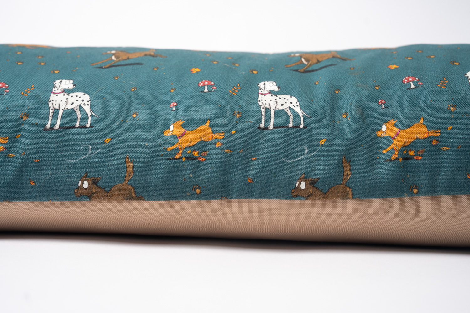 Close up of the Teal, Muddy paws' deep filled, orthopedic dog beds designed by Emily Cole Illustrations. Manufactured by Designed for Dogs.