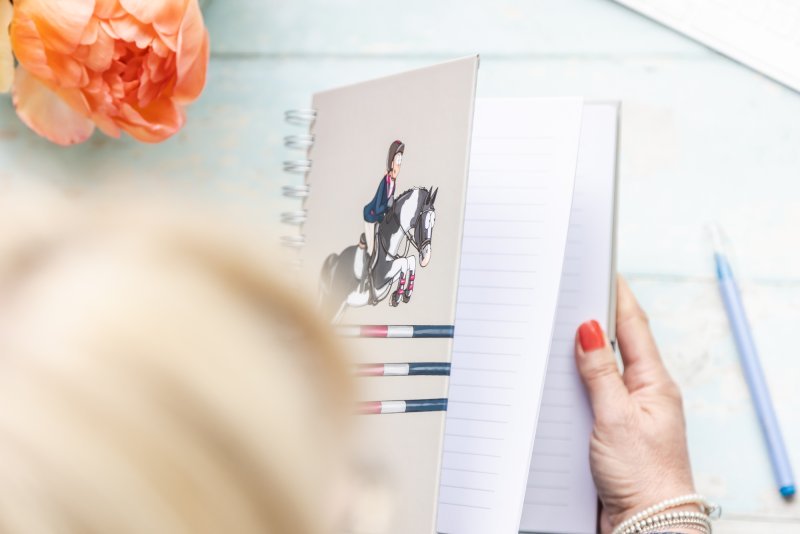 hardback piebald showjumper lined notebook by Emily Cole Illustrations being opened showing lined pages