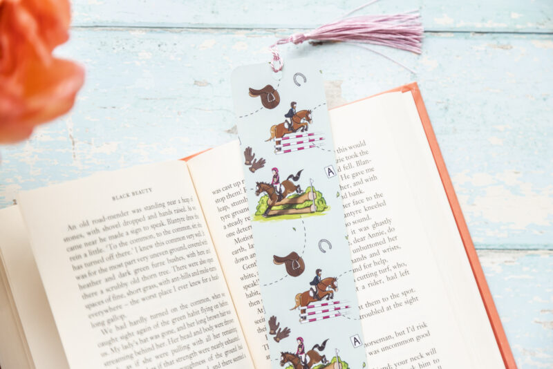 Double sided Sage Green bookmark. Adorned with event horses illustrated by Emily Cole.