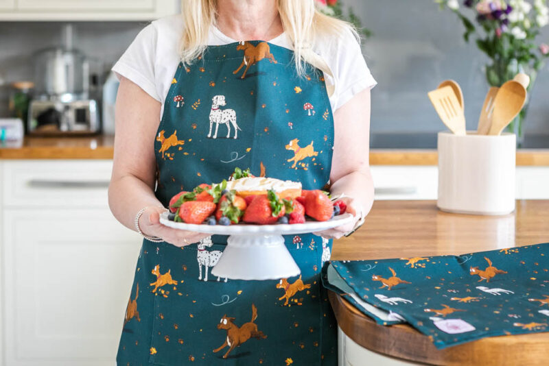 100% Cotton Apron in Teal. Featuring a Dog design, including a Collie, Dalmatian and Terrier Dogs.