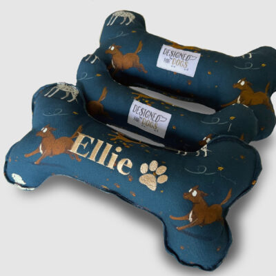 Teal bone shaped dog toy with Terrier, Dalmatian and Brown Dog Design.