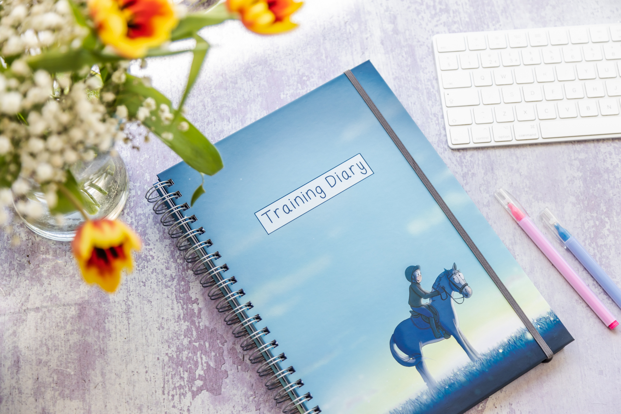 Training diary with a horse and rider on the front.