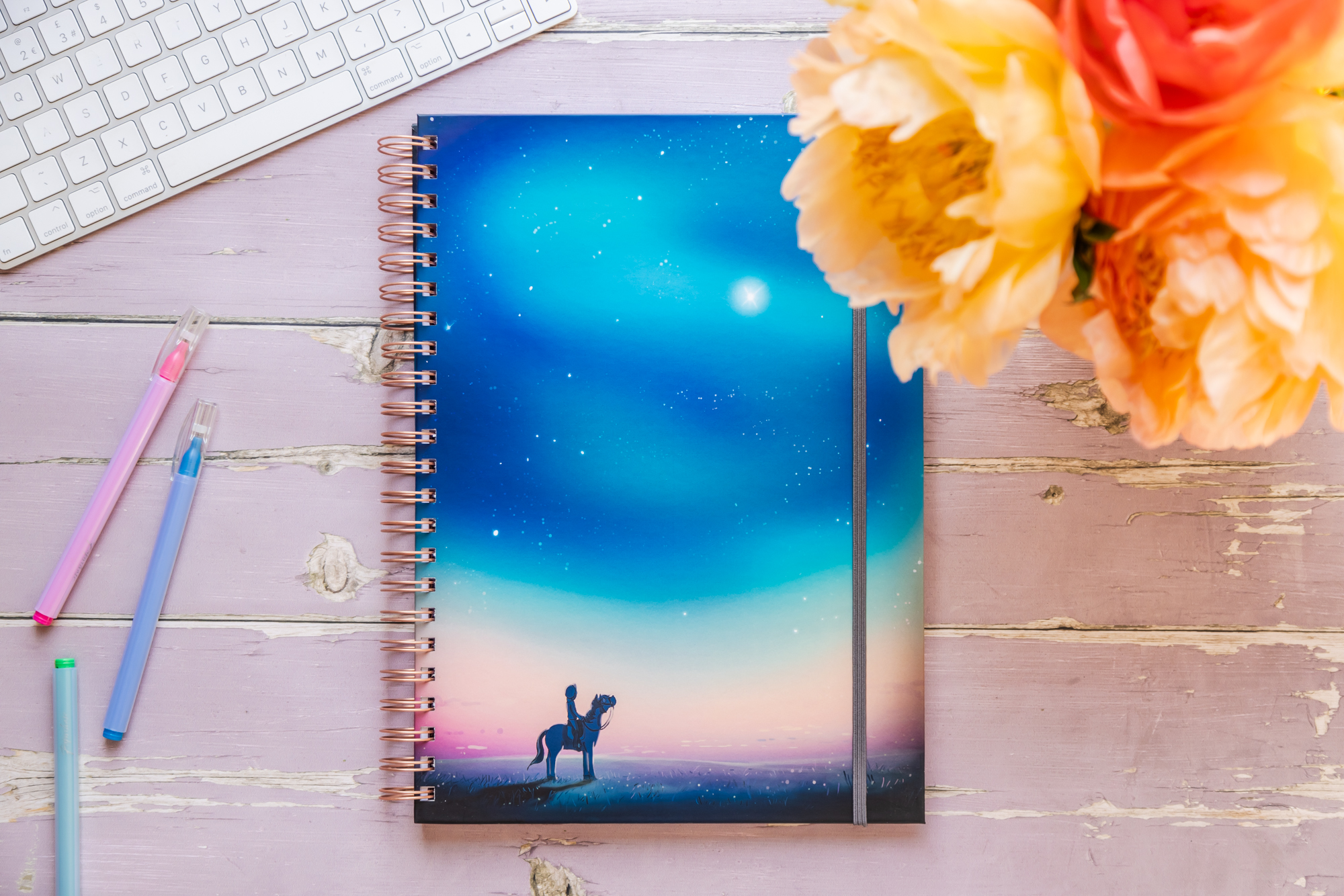'Starry Sky' hardback horse notebook. Featuring a horse and rider looking up at a beautiful starry sky aroura.