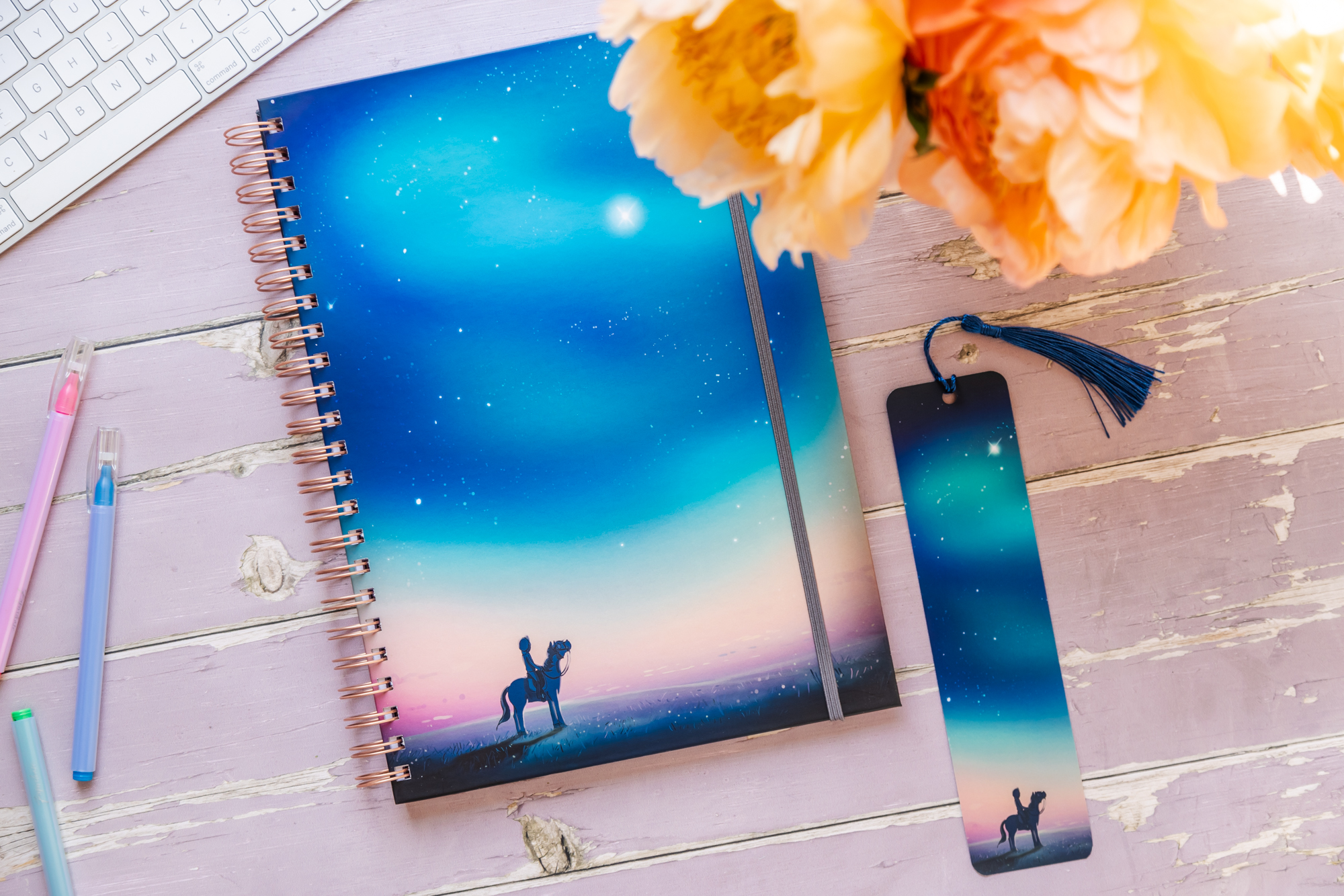 A4 'Starry Sky' hardback horse notebook. Featuring a horse and rider looking up at a beautiful starry sky aroura alongside matching bookmark.