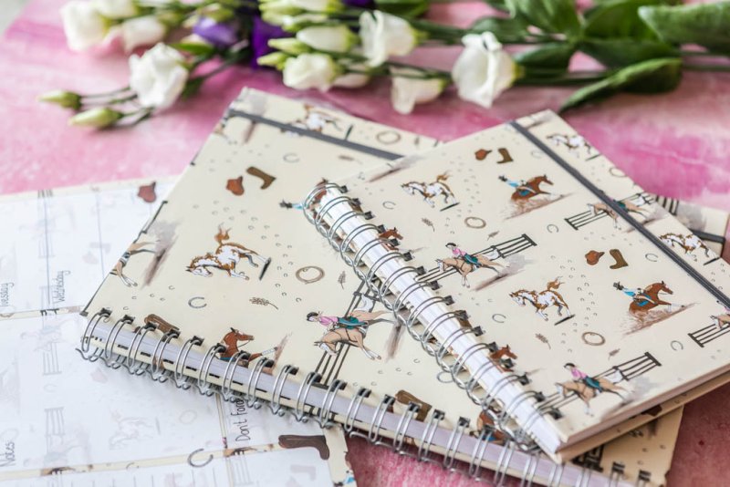 Two A4 and A5 Western horse notebooks with hardback covers featuring rustic equestrian designs
