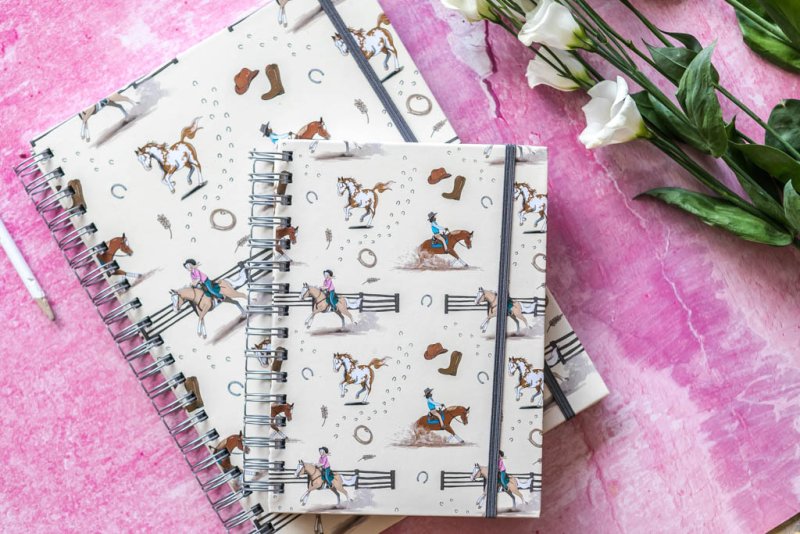 Two Western horse notebooks with hardback covers featuring rustic equestrian designs