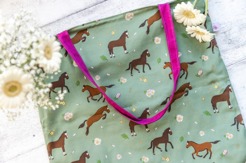 Bay Horse Tote Bag by Emily Cole Illustrations. Brown horse on a green background with pink liner.