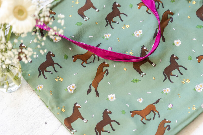 Bay Horse Tote Bag by Emily Cole Illustrations. Brown horse on a green background with pink liner.