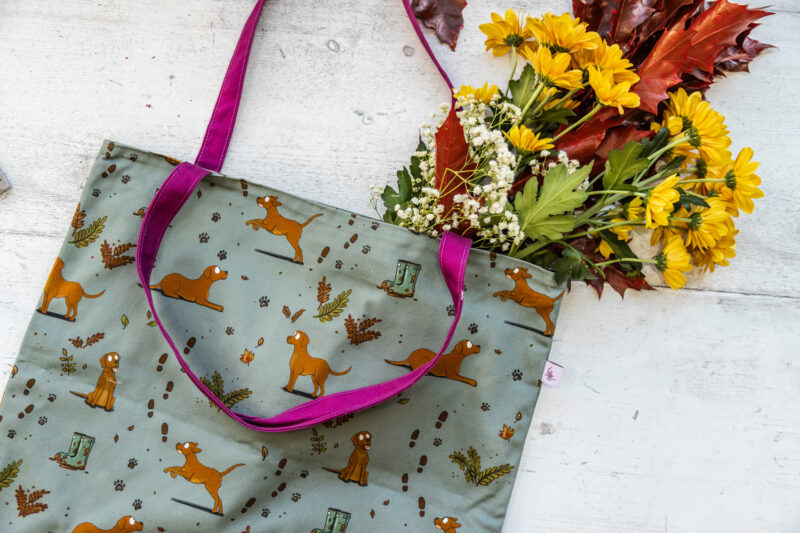 Oversized red fox Labrador Tote Bag by Emily Cole Illustrations. Yellow Labradors on a green background. Lined and zipped tote bag.