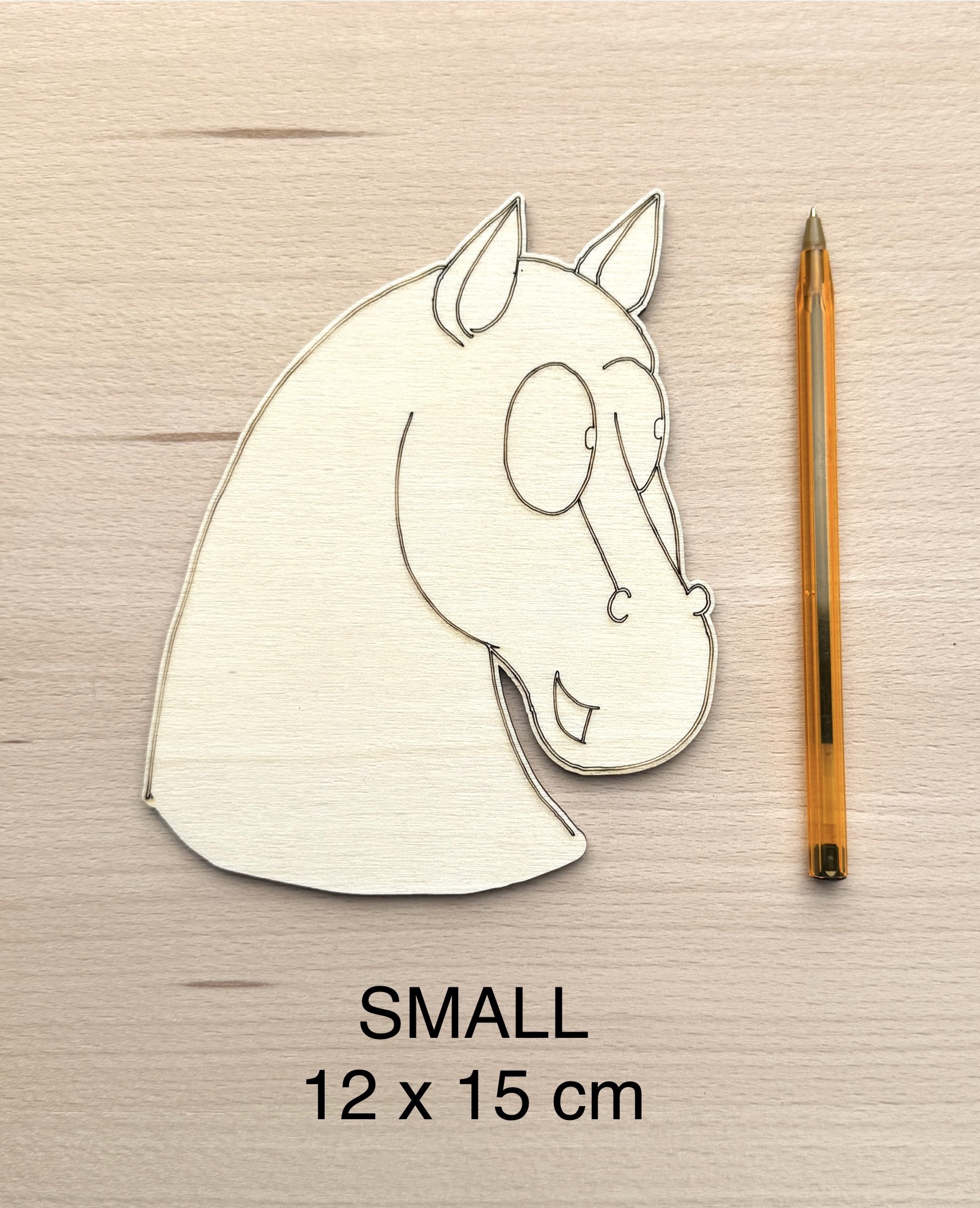 Unpainted small wooden horse head cutout for painting.