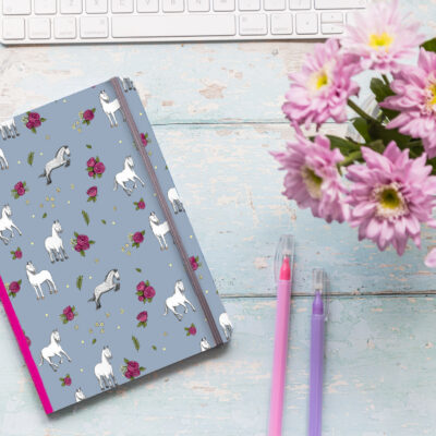 A5 soft cover notebook with grey horse pattern and grey elastic closure.