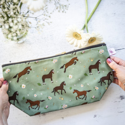 Bay horse wash bag. Brown horses on a green background fabric zipped and lined makeup bag by Emily Cole Illustrations