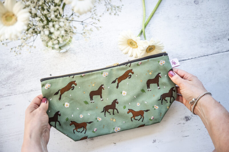 Bay horse wash bag. Brown horses on a green background fabric zipped and lined makeup bag by Emily Cole Illustrations