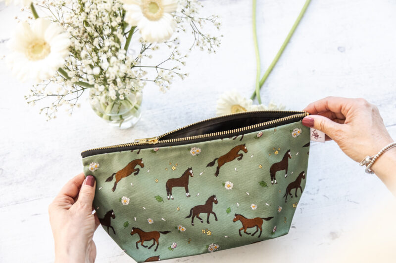 Bay horse wash bag. Brown horses on a green background fabric zipped and lined makeup bag by Emily Cole Illustrations