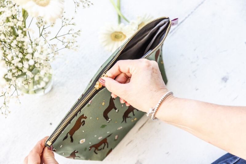 Bay horse wash bag. Brown horses on a green background fabric zipped and lined makeup bag by Emily Cole Illustrations