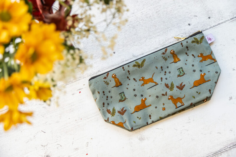Fox Red Yellow Labrador patterned wash bag by Emily Cole Illustrations on a sage green background