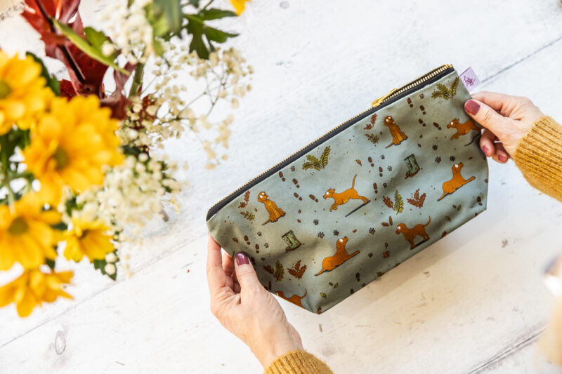 Fox Red Yellow Labrador patterned wash bag by Emily Cole Illustrations on a sage green background