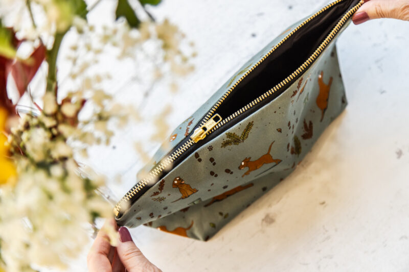 Fox Red Yellow Labrador patterned wash bag by Emily Cole Illustrations on a sage green background