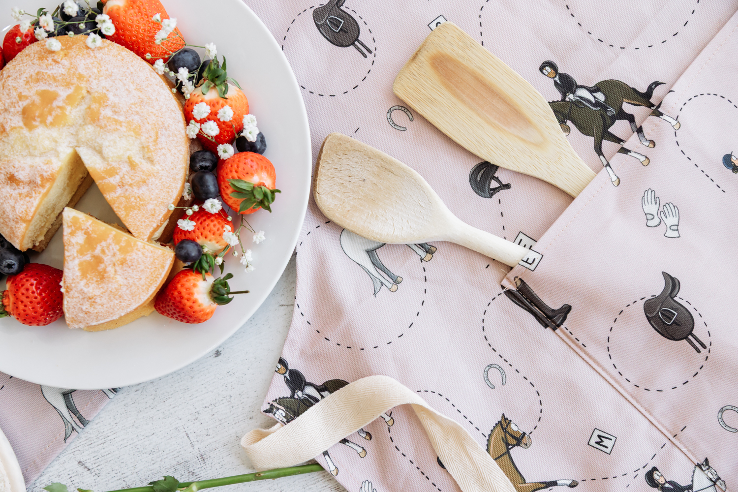 Pink dressage horse pattern homeware collection by Emily Cole Illustrations apron close-up